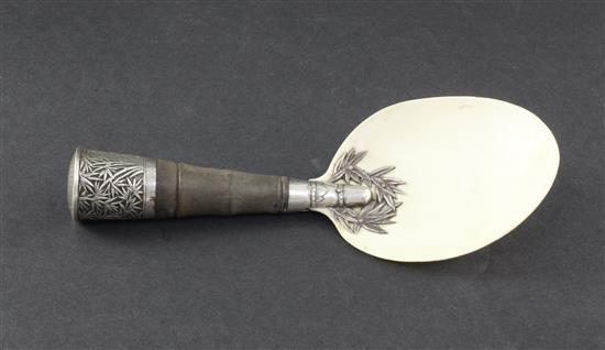 A Chinese silver mounted rhinoceros horn handled serving spoon, late 19th century, length 20cm
